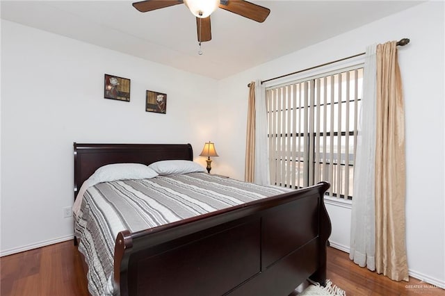 bedroom featuring dark wood-type flooring and ceiling fan