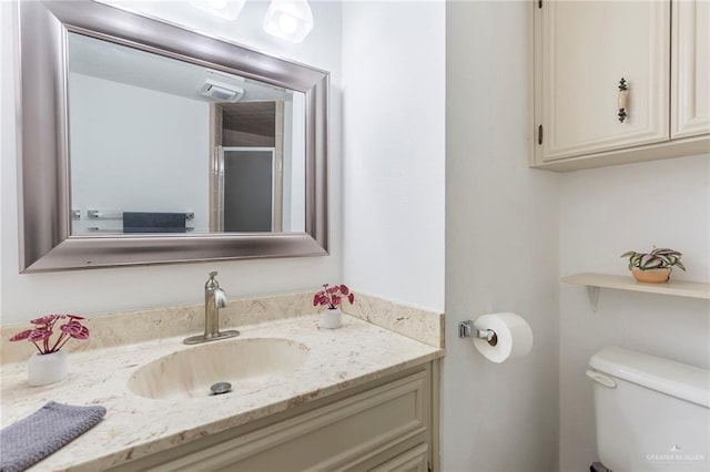 bathroom with vanity and toilet