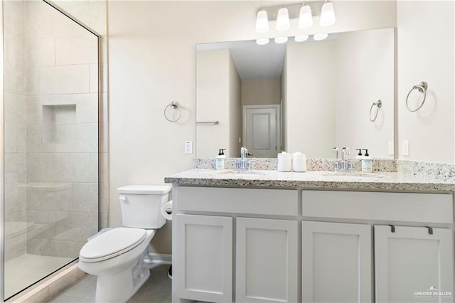 6327 Cascada Bend Rd, Mcallen, TX 78504 - full bath featuring double vanity, tiled shower, and tile patterned flooring