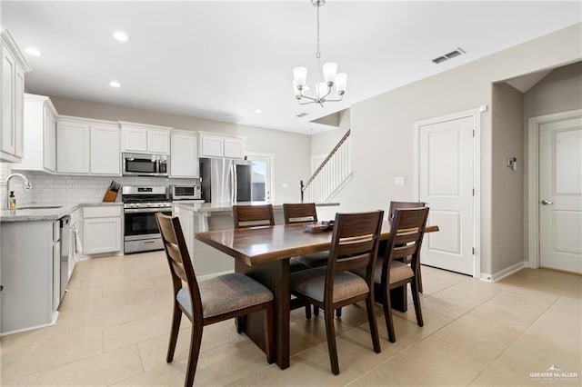6327 Cascada Bend Rd, Mcallen, TX 78504 - dining space with a chandelier, light tile patterned flooring, recessed lighting, and stairs