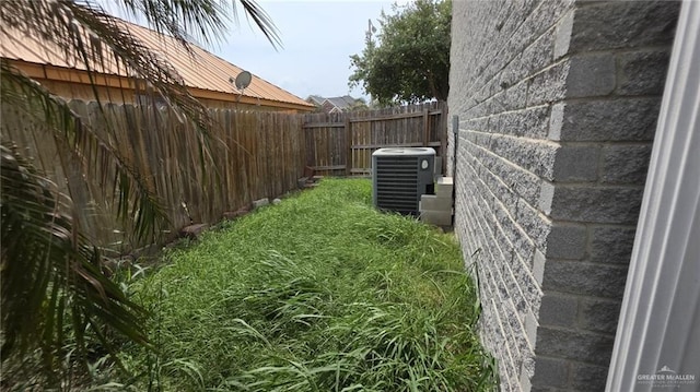 2216 N 48th St, Mcallen, TX 78501 - view of yard featuring central AC unit and fence