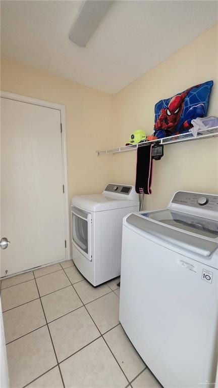 2216 N 48th St, Mcallen, TX 78501 - washroom with laundry area, washing machine and dryer, and light tile patterned floors