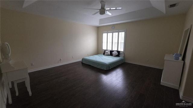 2216 N 48th St, Mcallen, TX 78501 - bedroom with a ceiling fan, baseboards, dark wood-type flooring, a tray ceiling, and visible vents