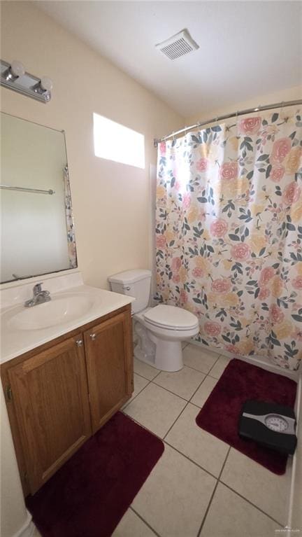 2216 N 48th St, Mcallen, TX 78501 - bathroom featuring vanity, toilet, tile patterned floors, curtained shower, and visible vents