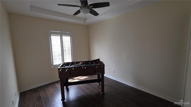 2216 N 48th St, Mcallen, TX 78501 - playroom featuring a ceiling fan, baseboards, dark wood finished floors, and a tray ceiling
