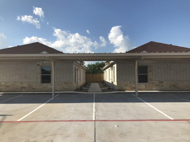covered parking lot with fence