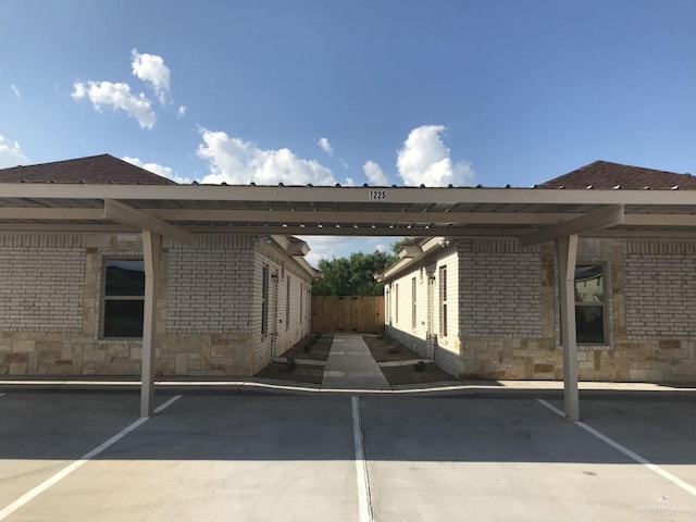 covered parking lot with fence