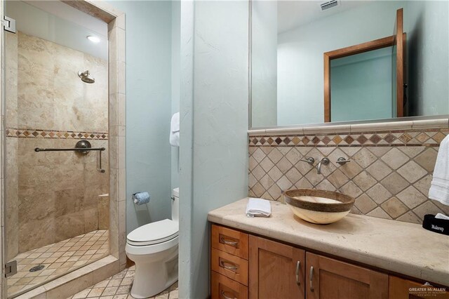 4616 Gulf Blvd S, Unit South, South Padre Island, TX 78597 - bathroom featuring toilet, a shower stall, and vanity