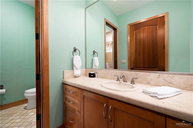 4616 Gulf Blvd S, Unit South, South Padre Island, TX 78597 - bathroom with vanity and toilet