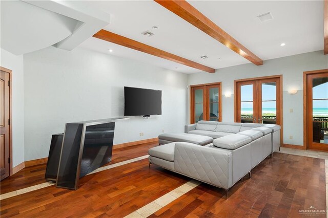 4616 Gulf Blvd S, Unit South, South Padre Island, TX 78597 - living area featuring beam ceiling, wood finished floors, french doors, baseboards, and recessed lighting