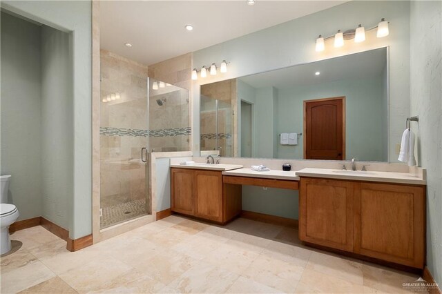 4616 Gulf Blvd S, Unit South, South Padre Island, TX 78597 - full bath featuring toilet, double vanity, a stall shower, and recessed lighting