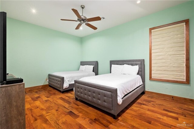 4616 Gulf Blvd S, Unit South, South Padre Island, TX 78597 - bedroom featuring wood finished floors, a ceiling fan, recessed lighting, and baseboards