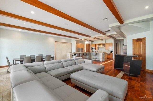 4616 Gulf Blvd S, Unit South, South Padre Island, TX 78597 - living room featuring beamed ceiling, baseboards, and recessed lighting