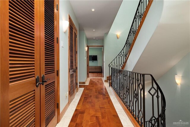 4616 Gulf Blvd S, Unit South, South Padre Island, TX 78597 - hall with wood finished floors, baseboards, and recessed lighting