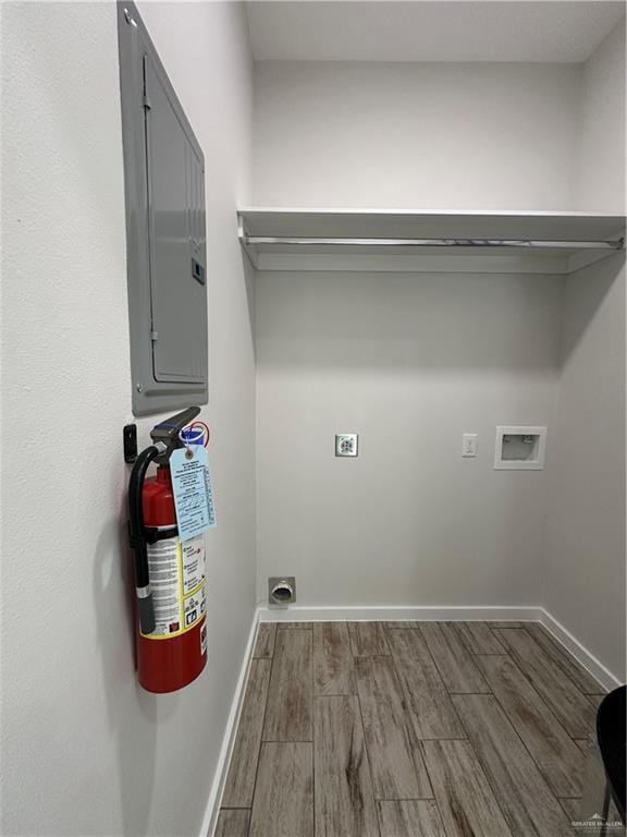 clothes washing area with hookup for a washing machine, dark wood-type flooring, and hookup for an electric dryer