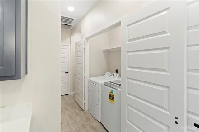 laundry room with visible vents, laundry area, recessed lighting, separate washer and dryer, and light wood-type flooring