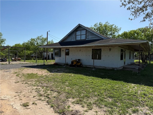 2421 W Mile 13 1/2 N, Weslaco, TX 78599 - rear view of property featuring a yard