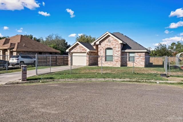 view of front of property with a front yard and a garage