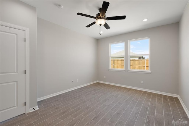 unfurnished room featuring baseboards, a ceiling fan, wood finished floors, and recessed lighting
