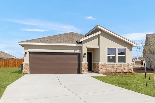 view of front of property featuring an attached garage, fence, driveway, and stone siding