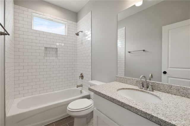 full bathroom featuring vanity, toilet, and tub / shower combination