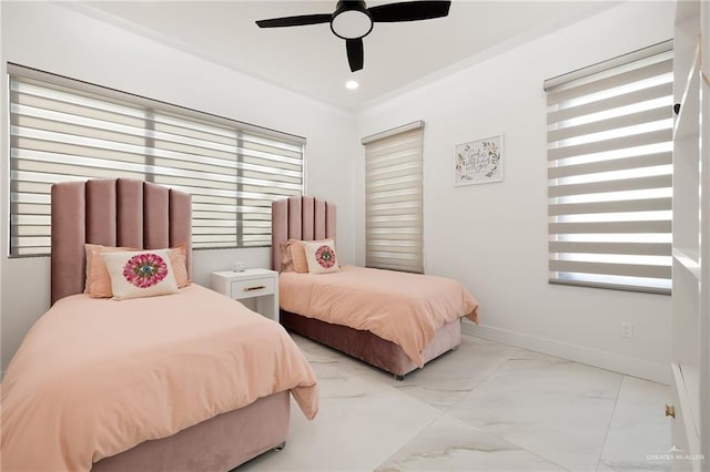 bedroom with ceiling fan and multiple windows