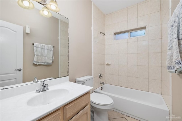 full bathroom featuring tile patterned floors, toilet, vanity, and tiled shower / bath