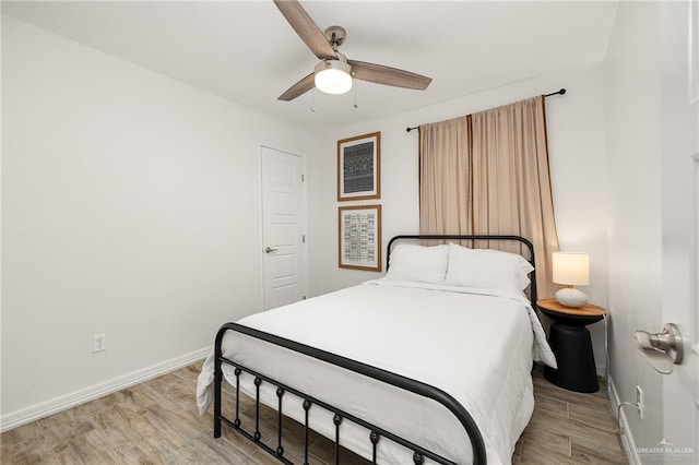 5824 N 23rd Ln, Mcallen, TX 78504 - bedroom with baseboards, light wood-style floors, and ceiling fan
