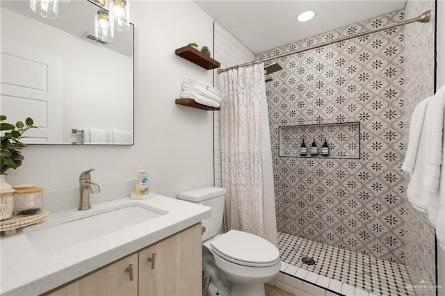 5824 N 23rd Ln, Mcallen, TX 78504 - bathroom featuring vanity, toilet, a shower stall, and recessed lighting
