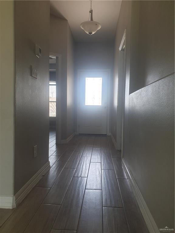 7612 N 40th St, Mcallen, TX 78504 - hall with wood tiled floors and baseboards