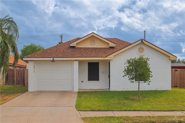 ranch-style home with a front yard and a garage