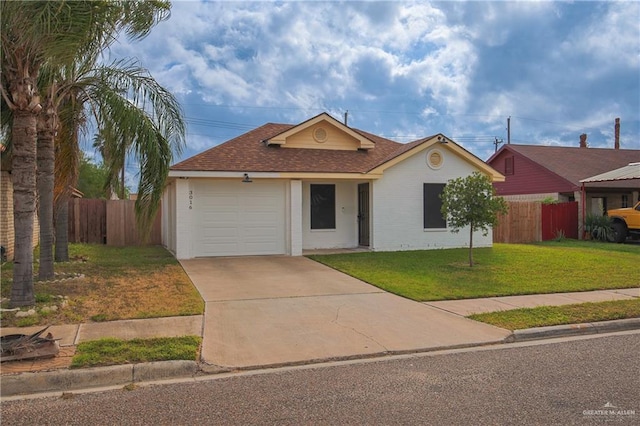 ranch-style house featuring a front lawn and a garage