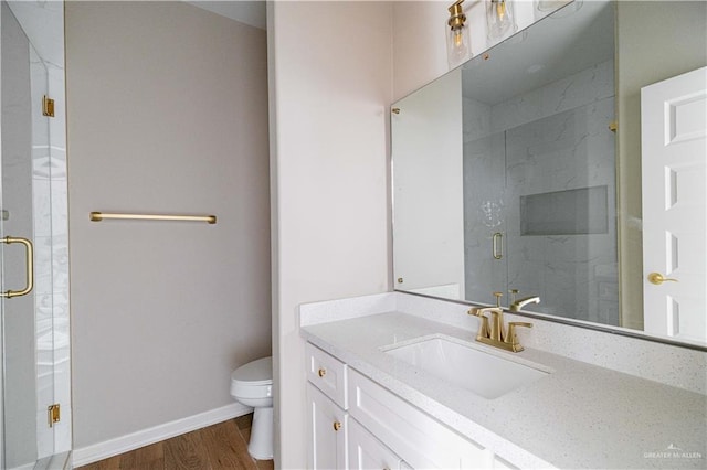 6608 Primavera St, Pharr, TX 78577 - full bath with toilet, wood finished floors, a stall shower, and vanity
