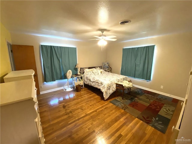 1005 Bryce Dr, Mission, TX 78572 - bedroom with wood finished floors, baseboards, and a ceiling fan
