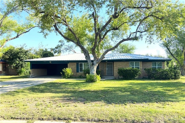 1005 Bryce Dr, Mission, TX 78572 - ranch-style house featuring driveway, a carport, metal roof, and a front yard