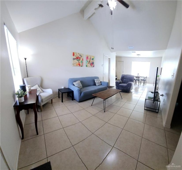 tiled living room with beamed ceiling, high vaulted ceiling, and ceiling fan