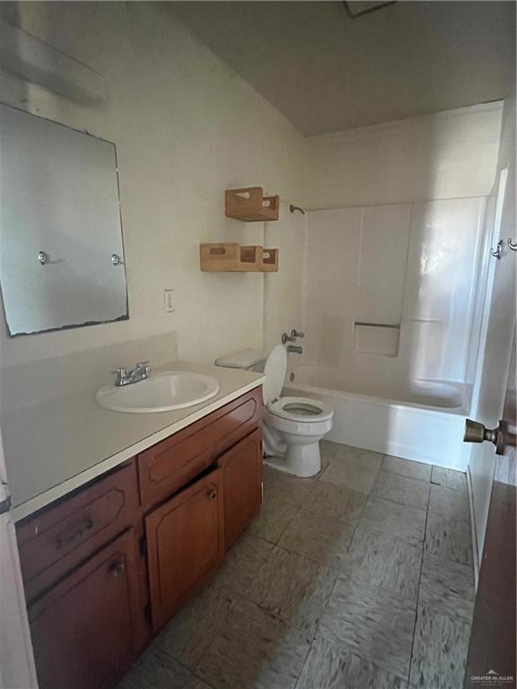 full bathroom featuring vanity,  shower combination, and toilet