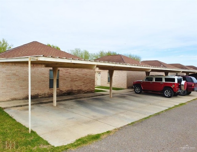 view of parking / parking lot with a carport