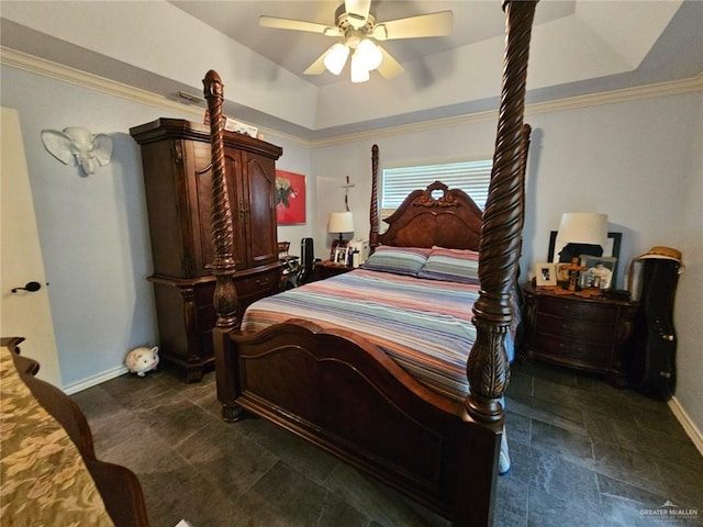 bedroom featuring baseboards, ornamental molding, a ceiling fan, and a raised ceiling