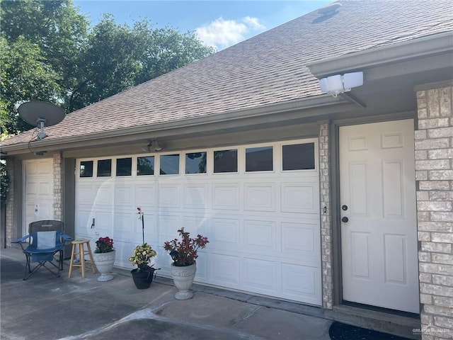 garage with concrete driveway