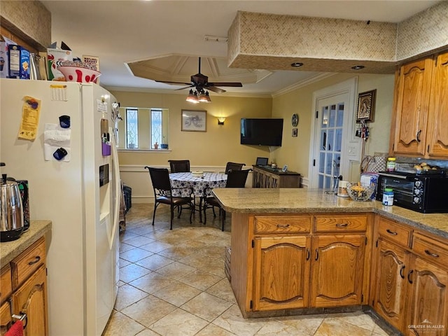 kitchen featuring brown cabinets, white fridge with ice dispenser, ornamental molding, and a peninsula