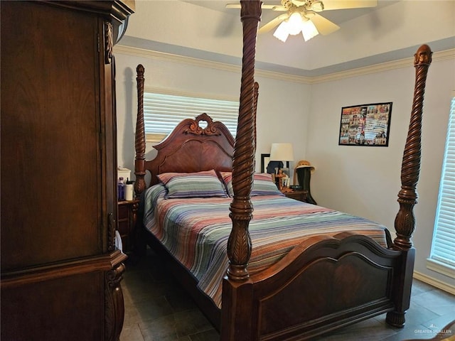tiled bedroom with a ceiling fan