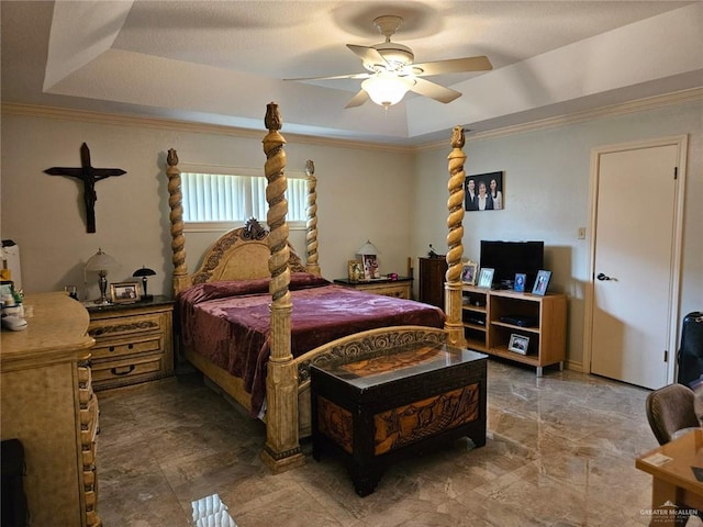 bedroom with ceiling fan, ornamental molding, and a raised ceiling
