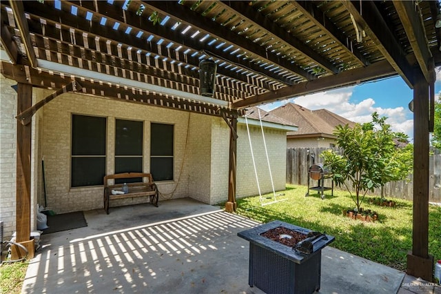 view of patio featuring a fire pit and a pergola