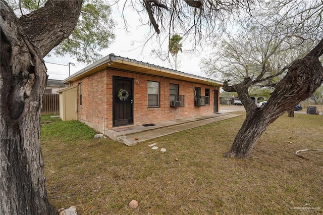 rear view of property featuring a yard