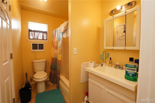 full bathroom featuring tile patterned flooring, shower / tub combo, vanity, and toilet