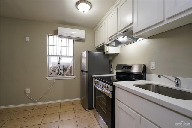 kitchen with a wall mounted air conditioner, white cabinetry, sink, stainless steel range with electric stovetop, and light tile patterned floors