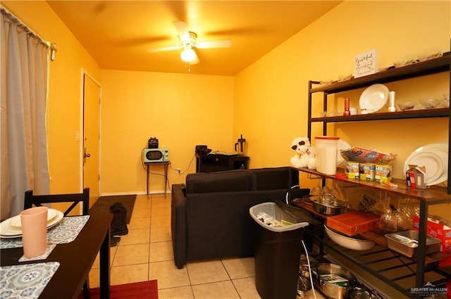 living room with light tile patterned flooring and ceiling fan