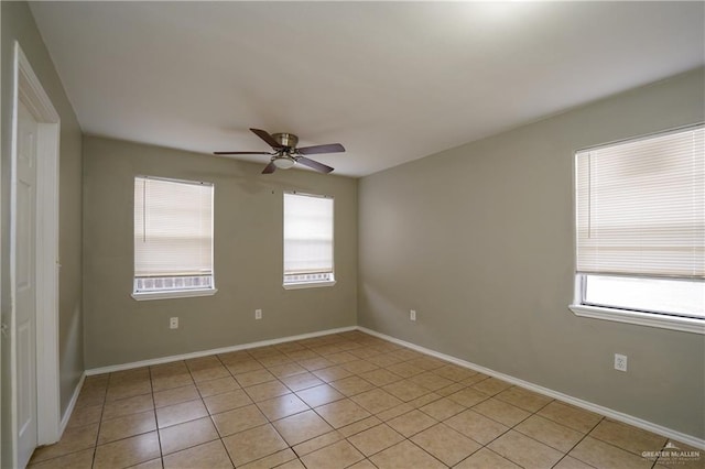 unfurnished room featuring light tile patterned floors and ceiling fan