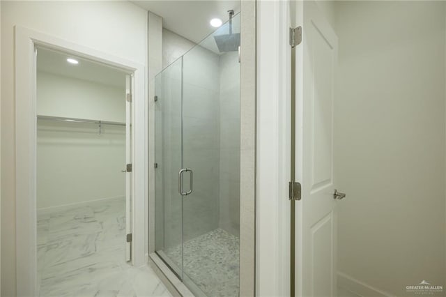 bathroom featuring a shower stall, baseboards, marble finish floor, recessed lighting, and a spacious closet